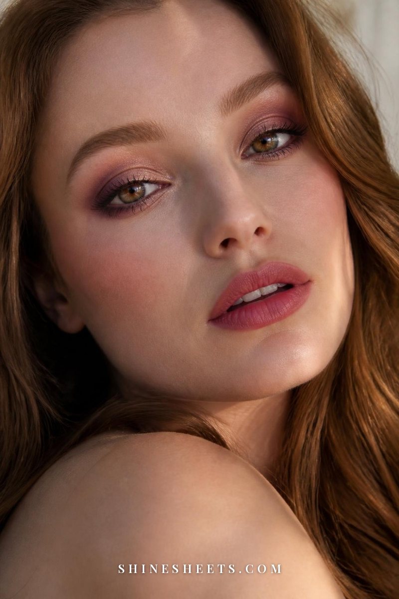 Woman with hazel-brown eyes wearing soft plum eyeshadow with champagne shimmer and mauve lips